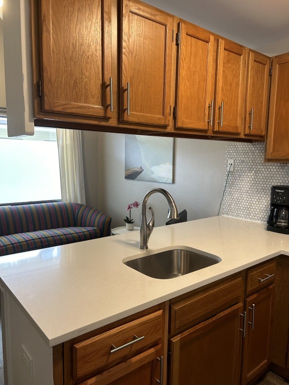 a kitchen with a sink and cabinets