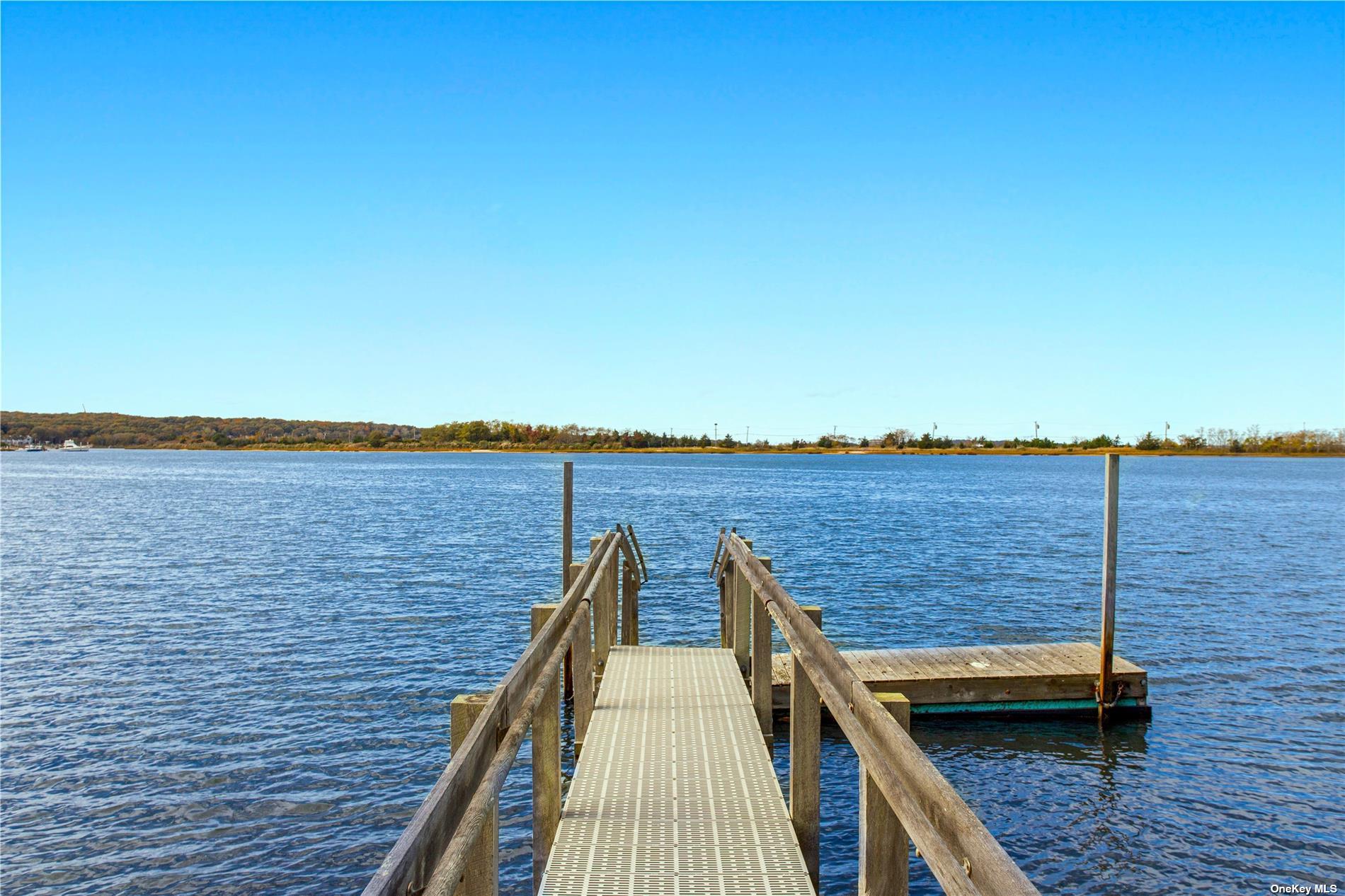 a view of wooden deck and city view