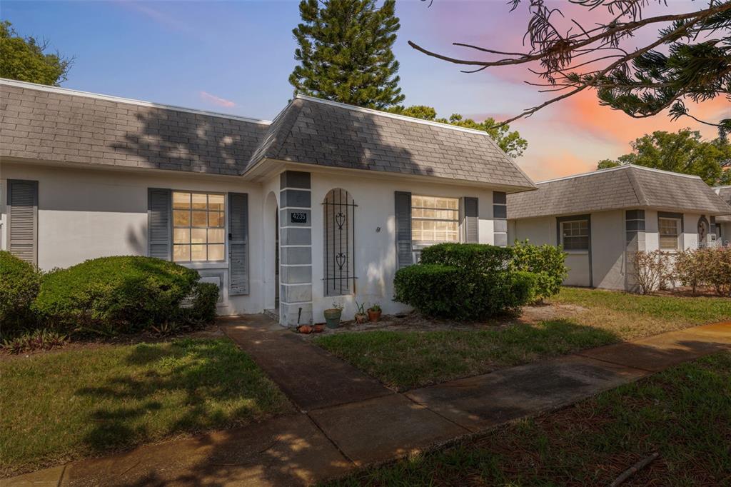 a view of a house with a yard