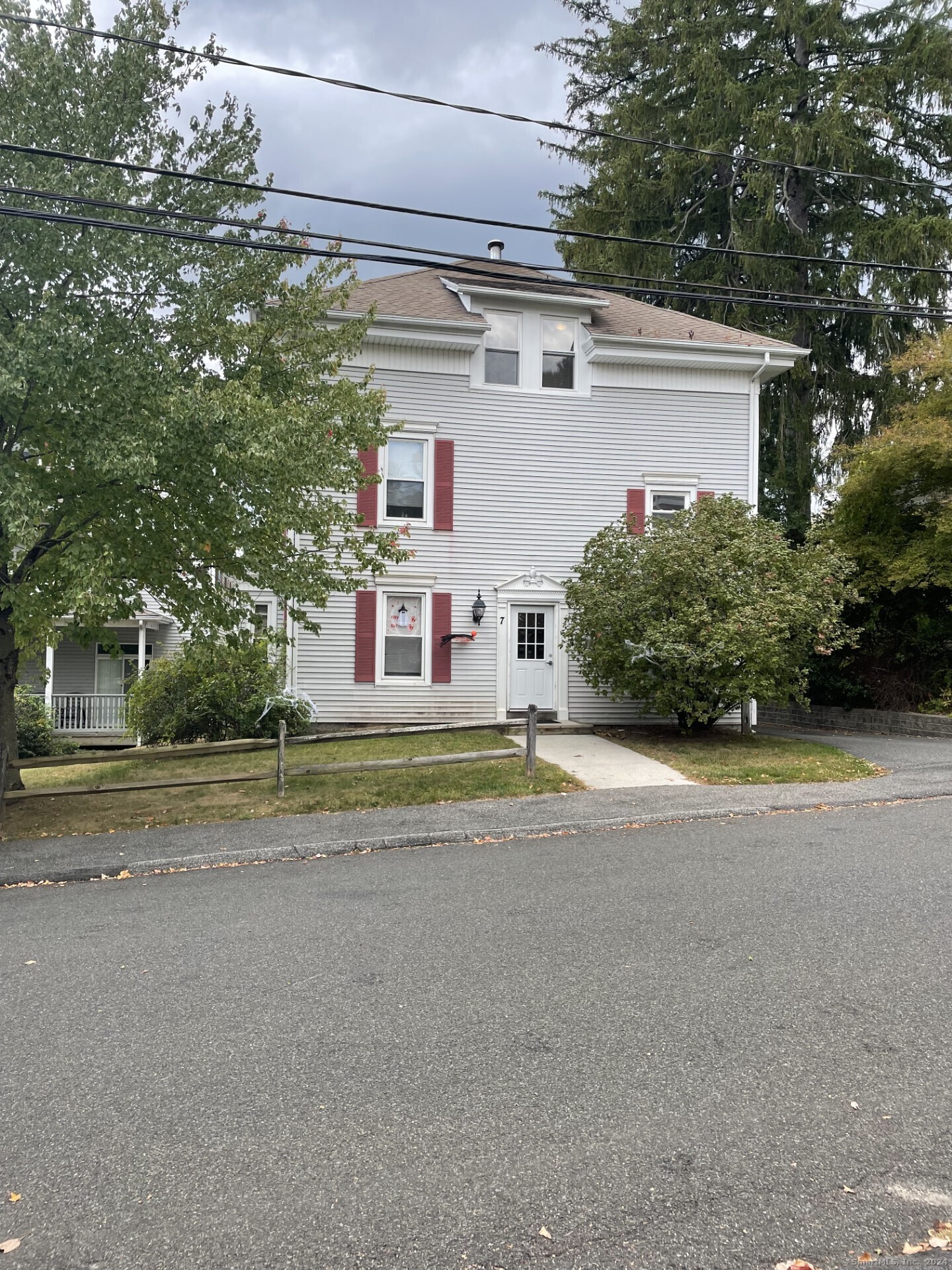 a view of a street with a house