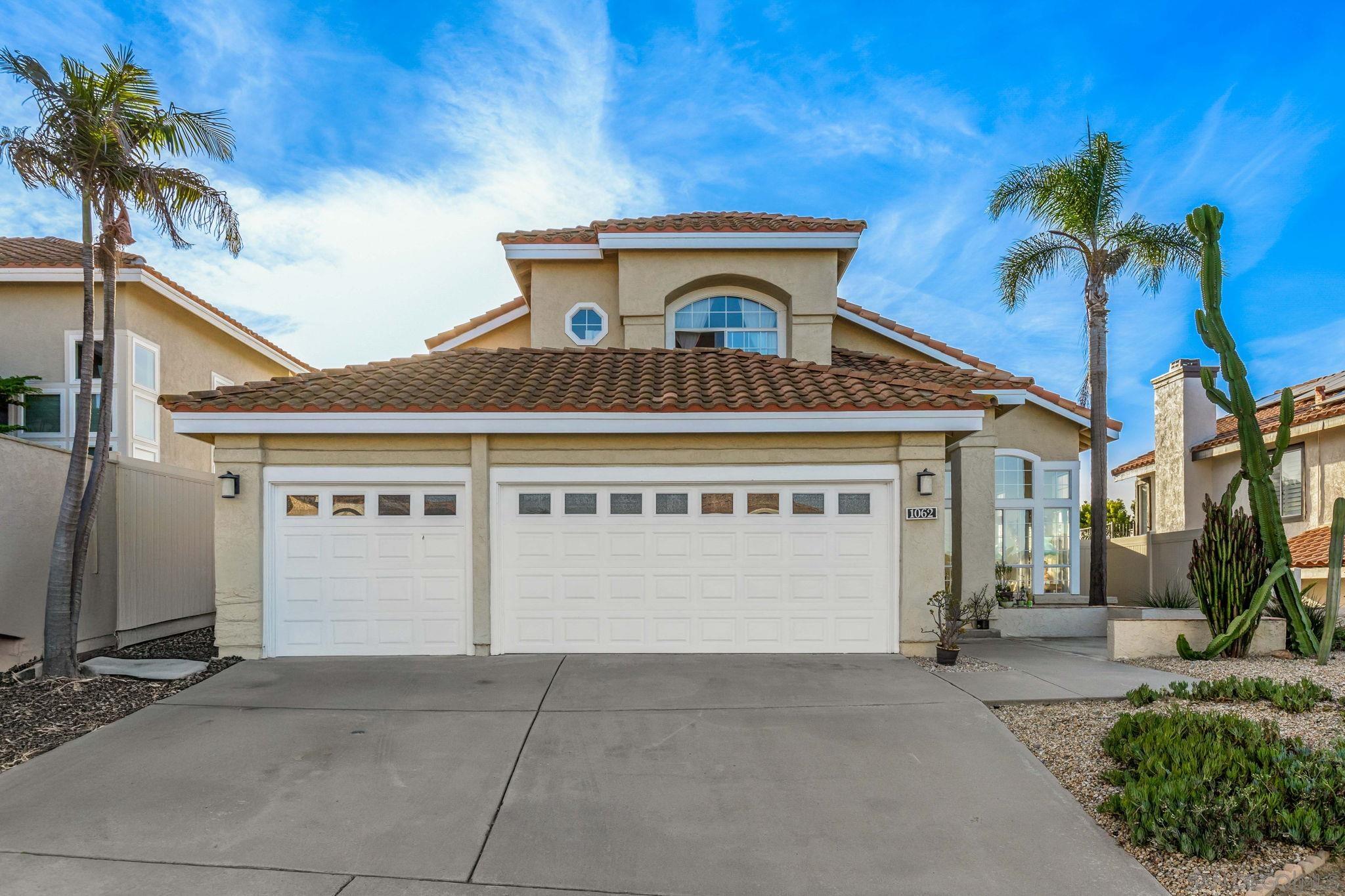 a front view of a house with a garage