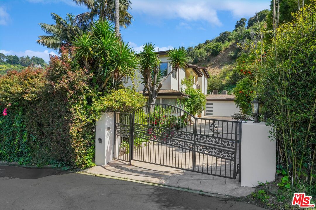 a view of a wrought iron fences in front of house