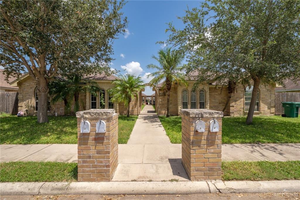 Mediterranean / spanish-style house with a front yard