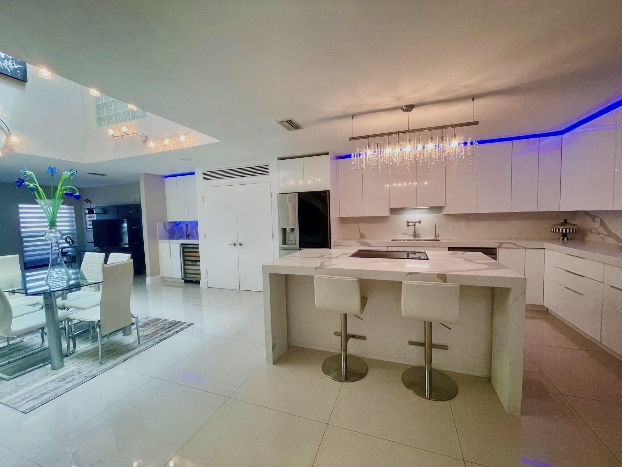 a kitchen with a sink cabinets and window