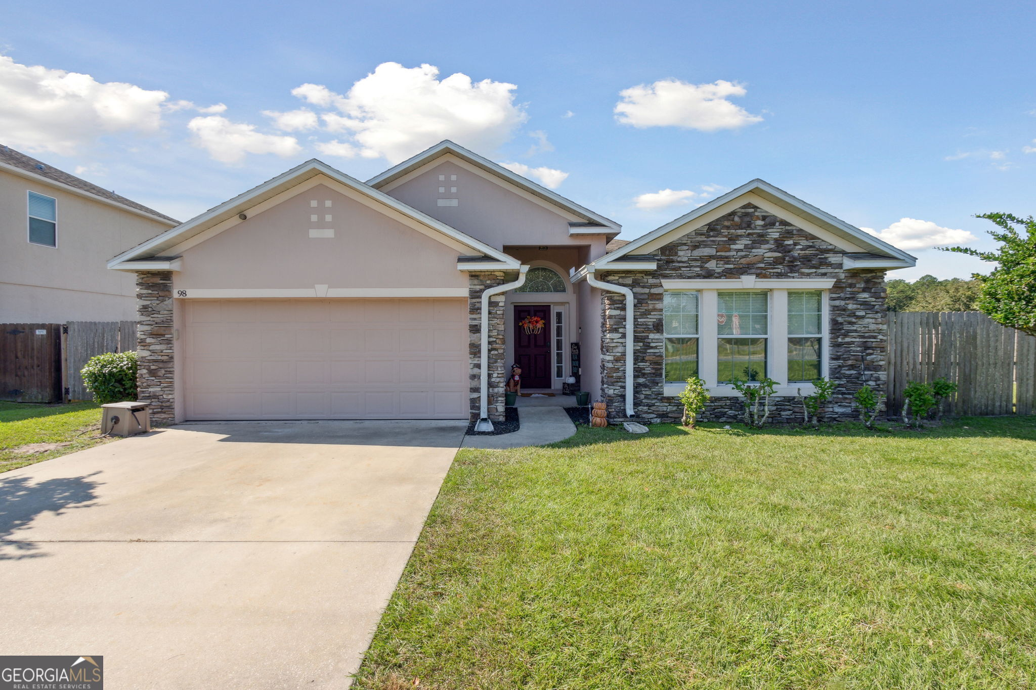 a front view of a house with a yard