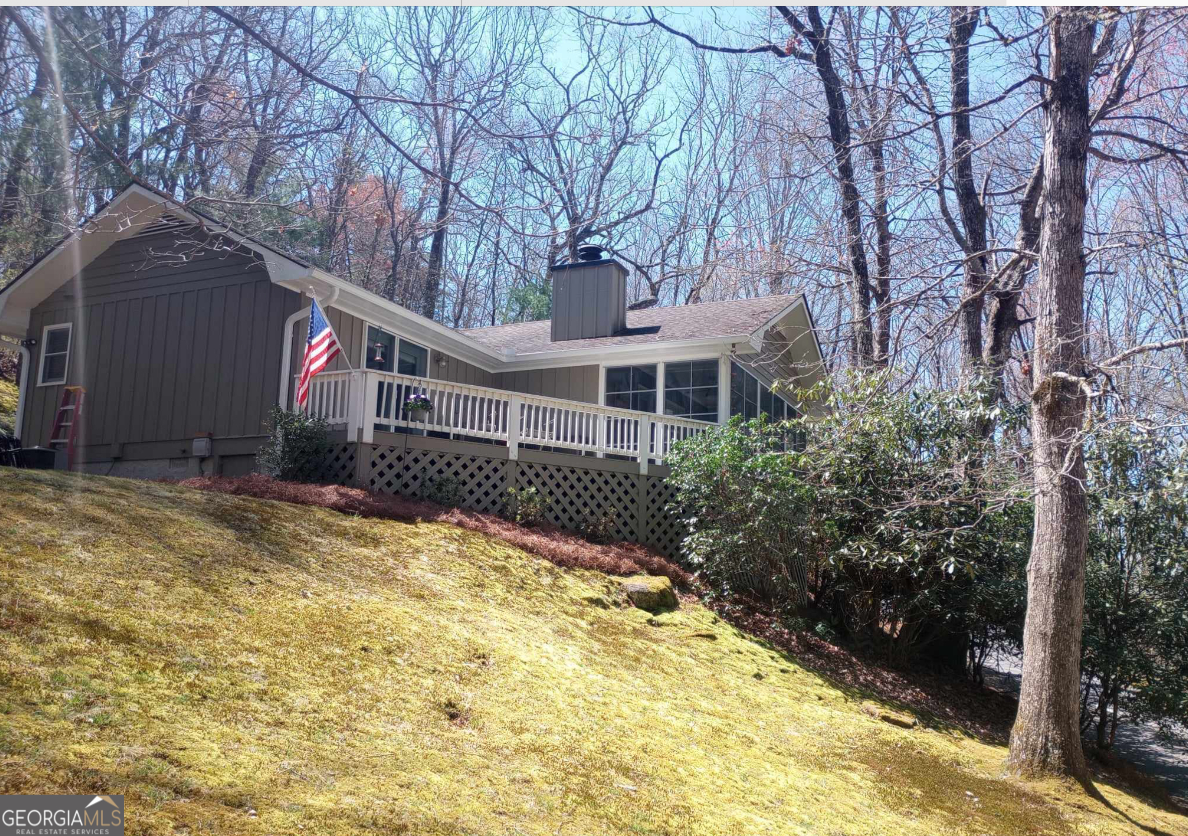 a view of a house with snow on the yard