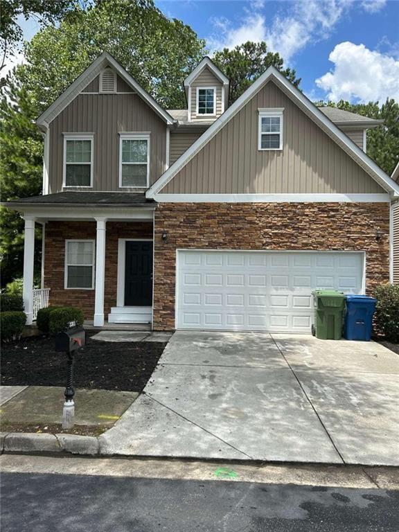 a front view of a house with garage