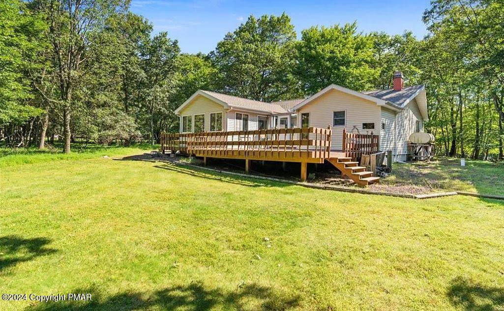 a front view of a house with a yard table and chairs