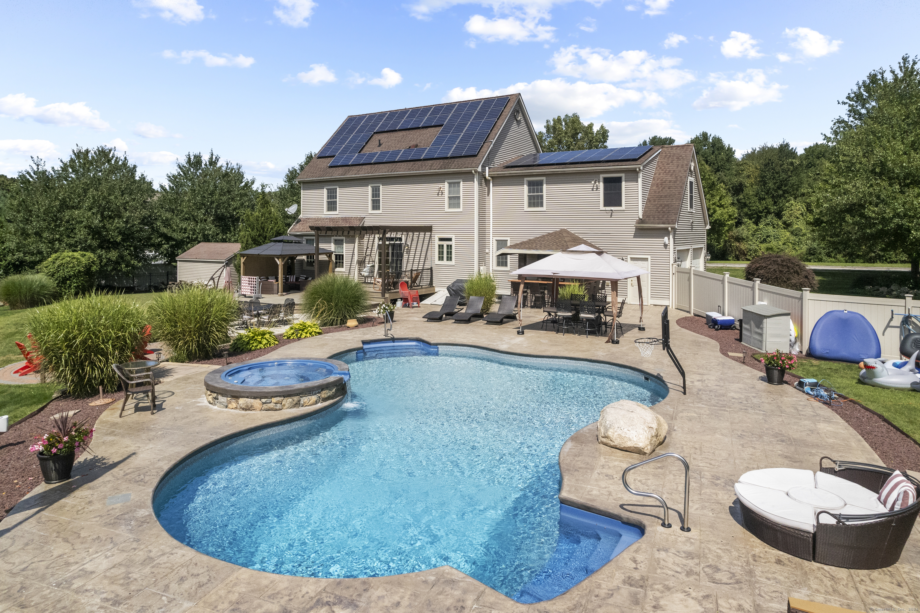 swimming pool view with a seating space