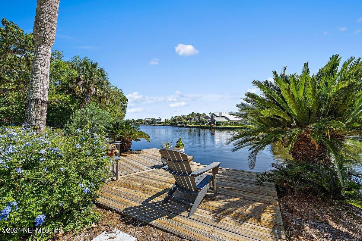 a view of a lake with sitting area