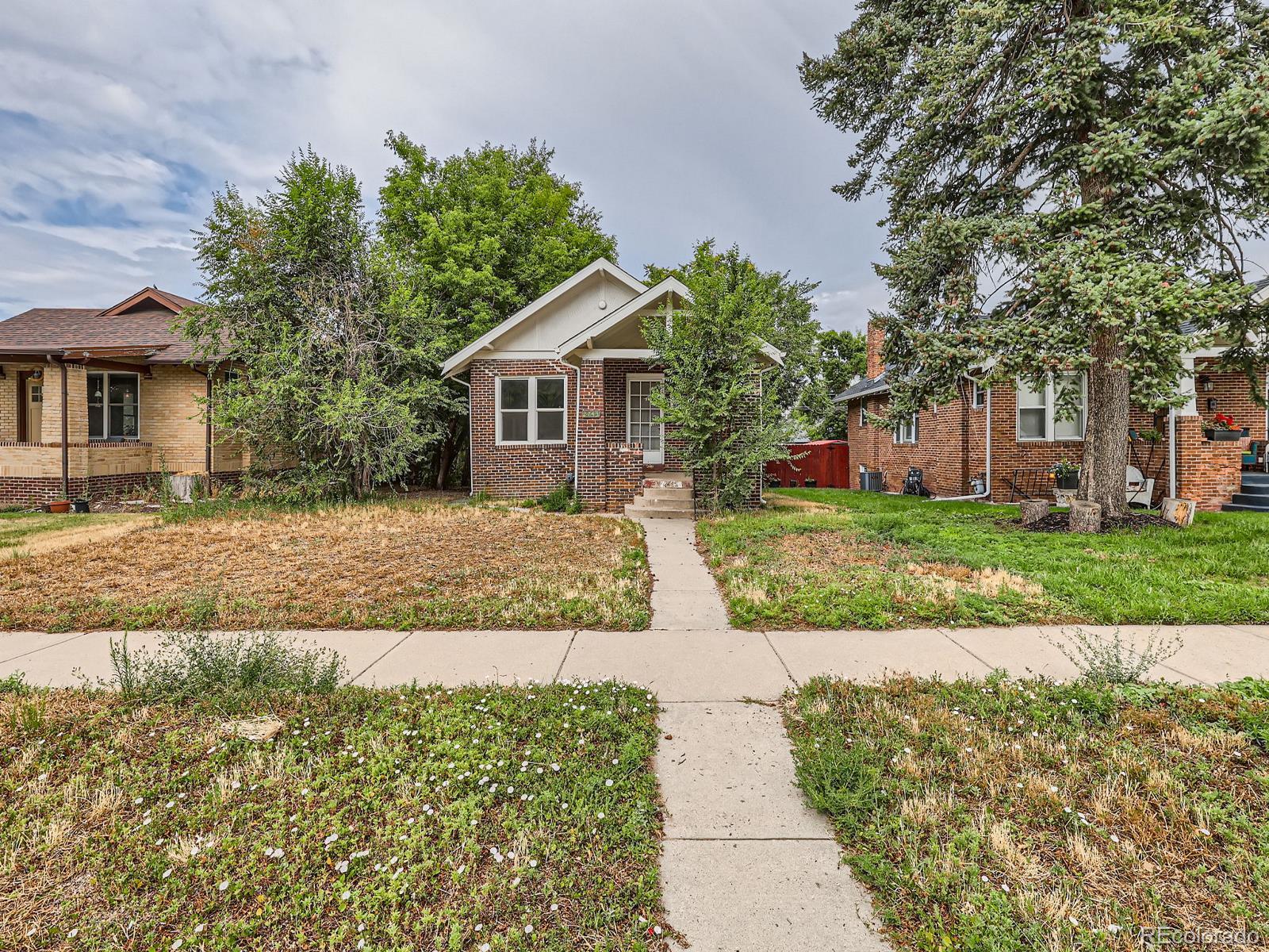 front view of a house with a yard