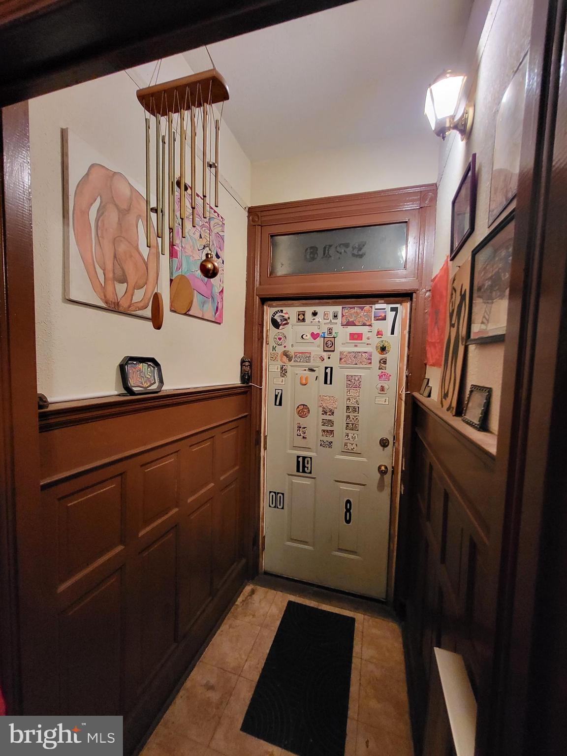 a view of a refrigerator and a utility room