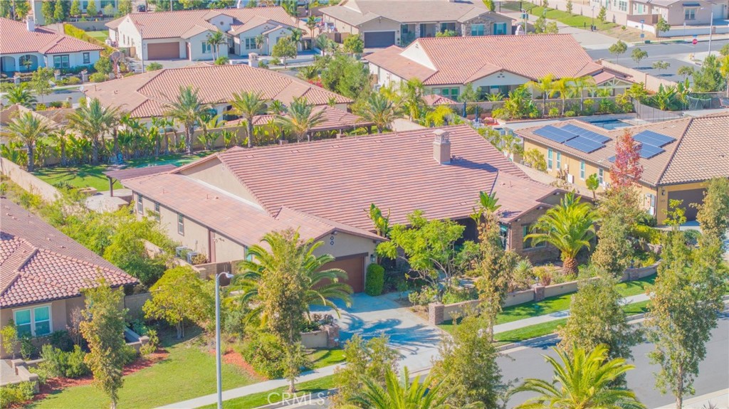 an aerial view of a house with yard