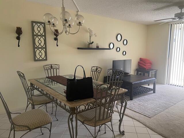 a view of a dining room with furniture and window