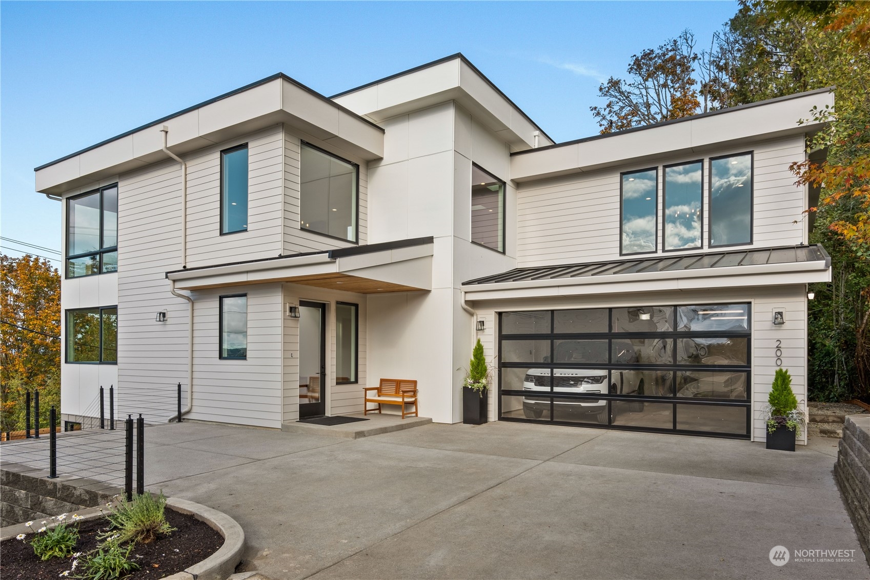 a front view of a house with garage