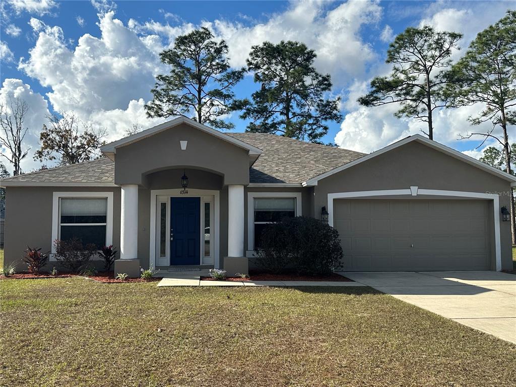 front view of a house with a yard