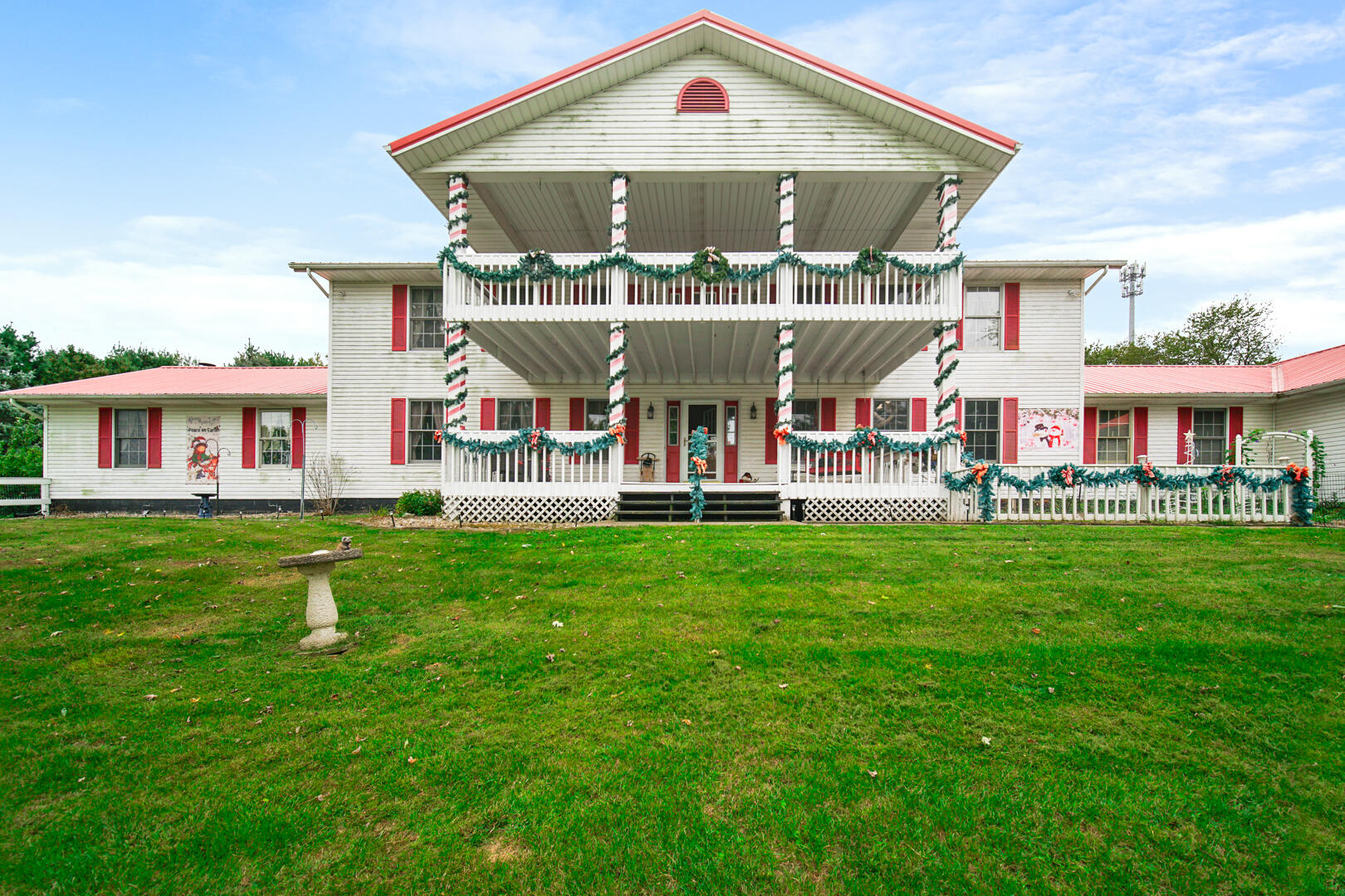 a front view of a house with a yard table and chairs