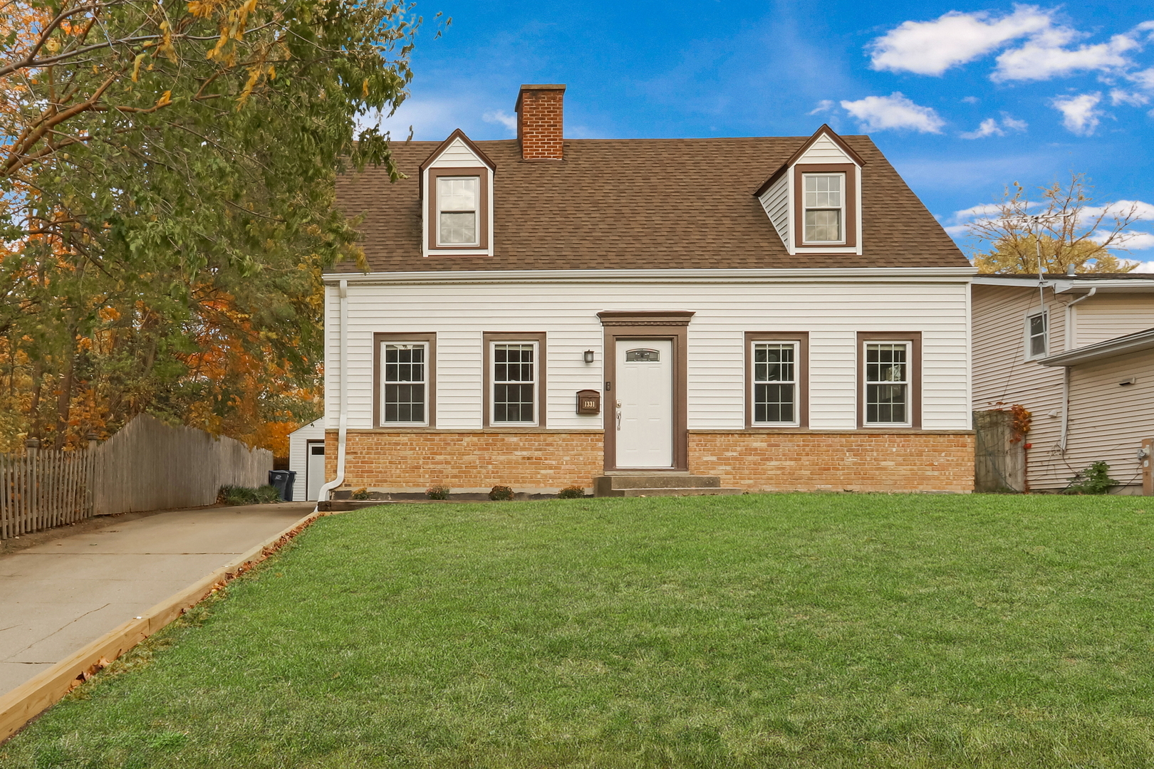 front view of a house with a yard