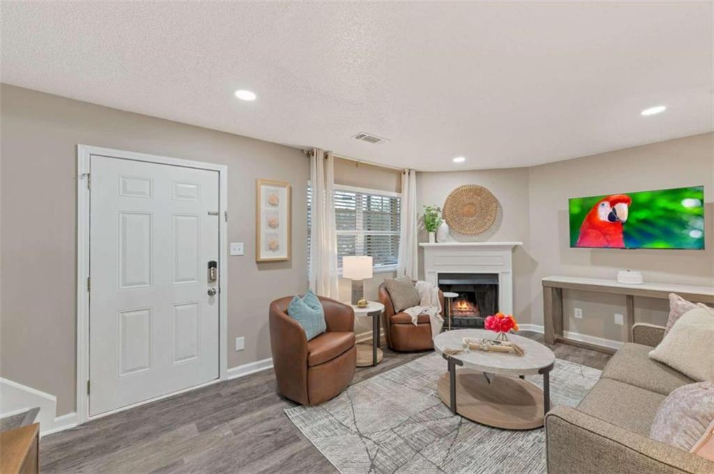 a living room with furniture window and a fireplace