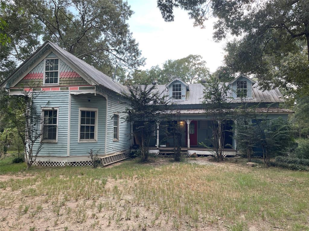 a view of house with yard