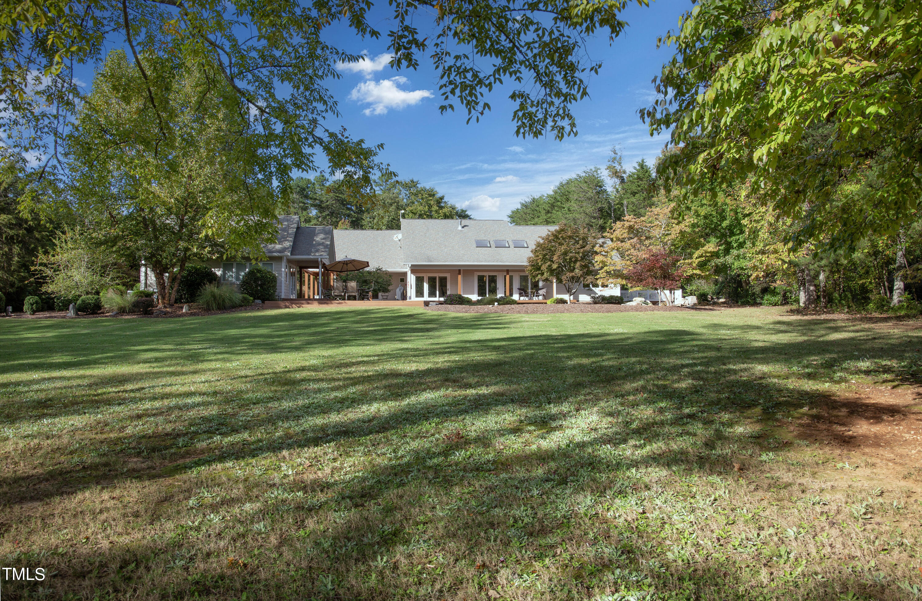 a view of a house with a big yard