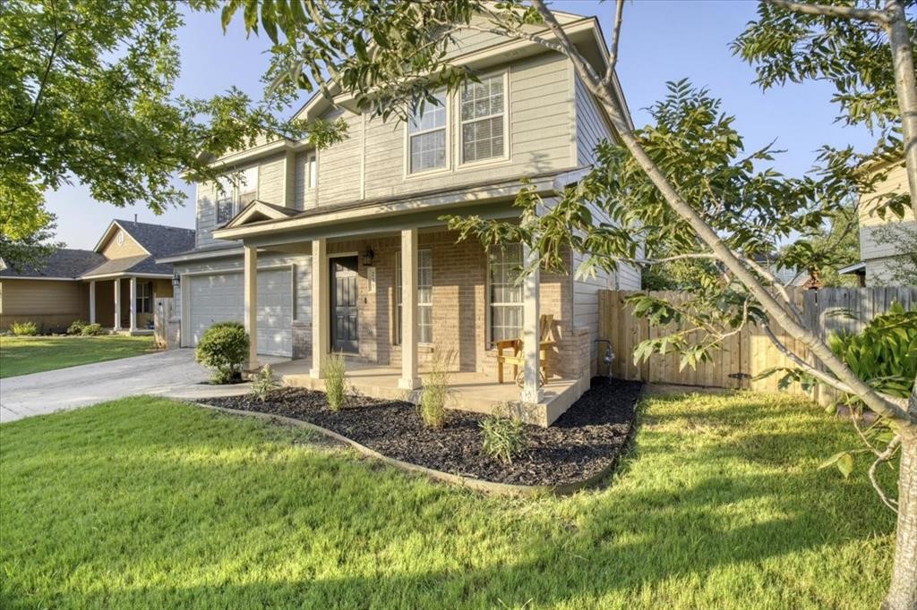 front view of a house with a yard