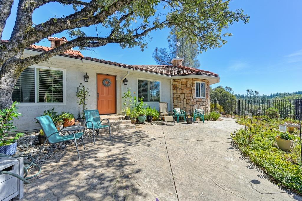 a front view of a house with patio