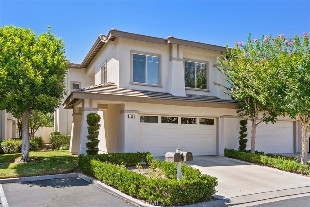 Front facade: Two-car attached garage, Two driveway parking spaces, two  adjacent and two nearby parking spaces