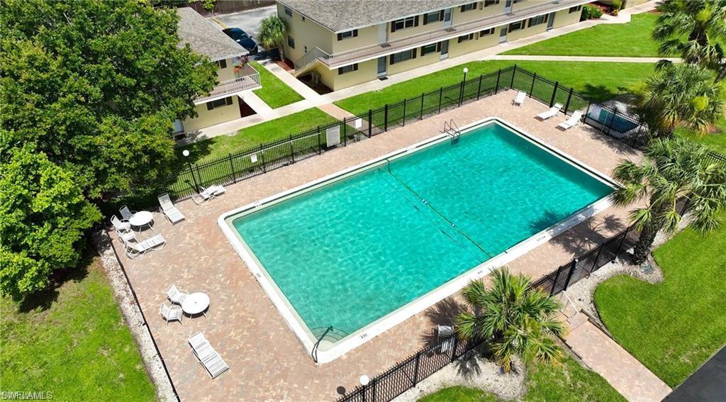 View of pool featuring a lawn