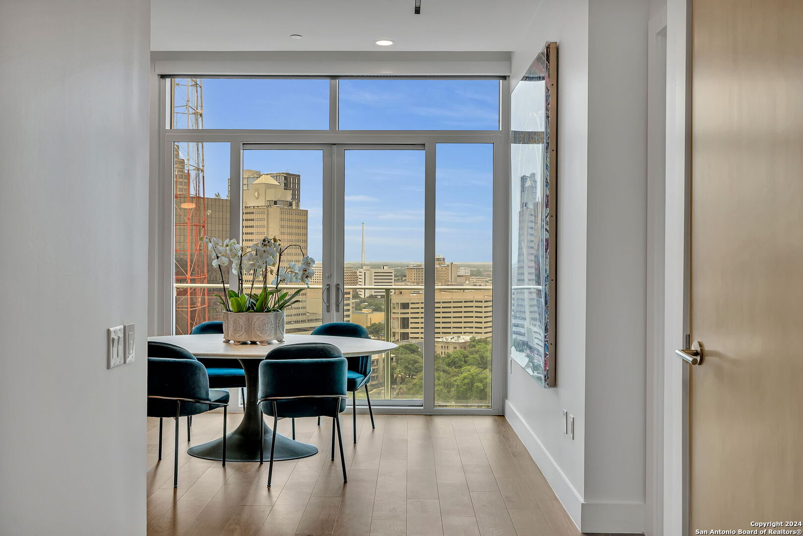 a dining room with furniture and window