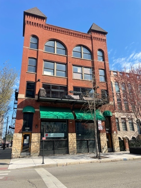 a view of a building with a street