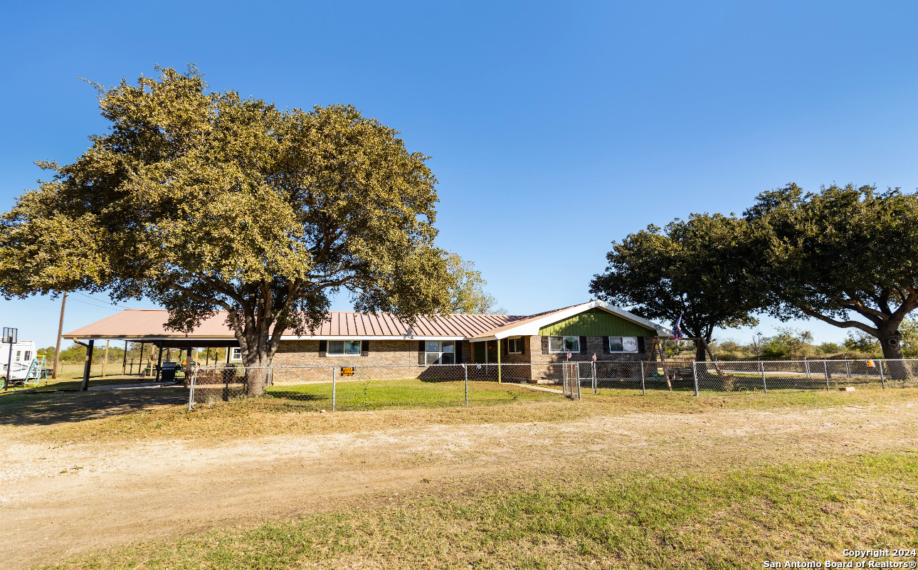 a view of house with trees in the background