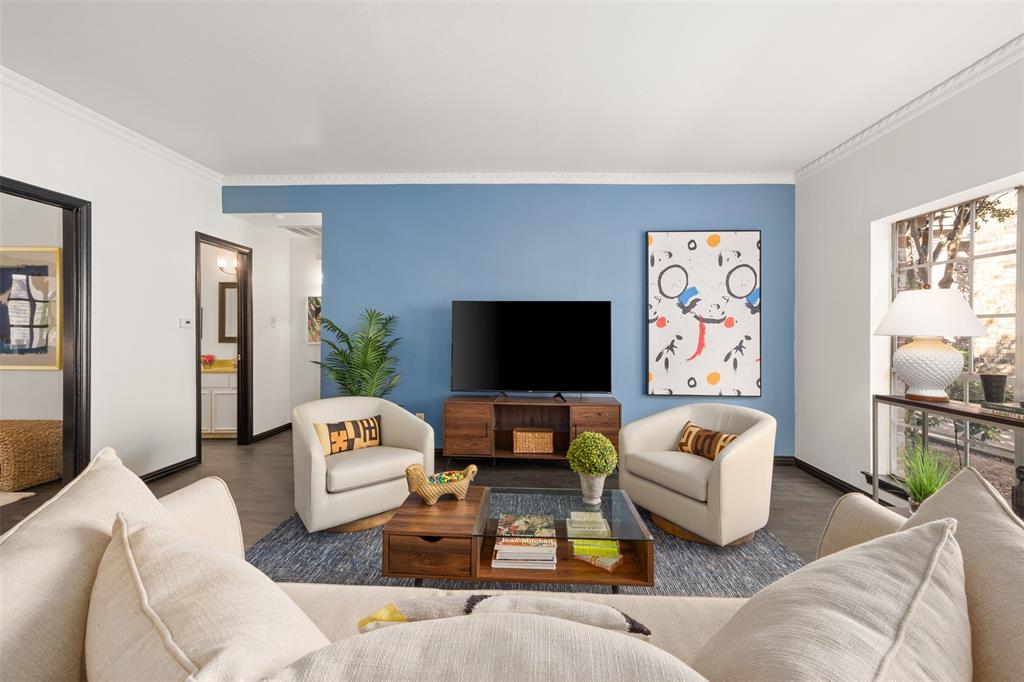 a living room with furniture and a flat screen tv