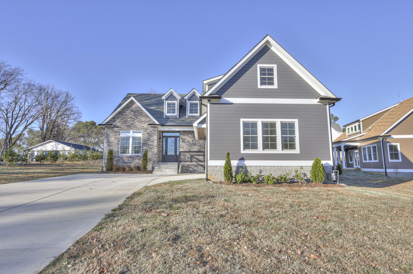 a front view of a house with a yard