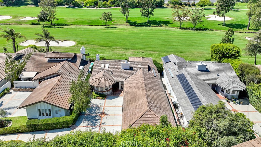 an aerial view of a house with outdoor space patio and outdoor seating