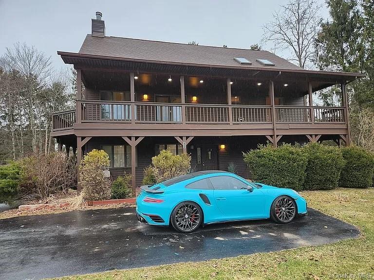 a front view of house with parking space