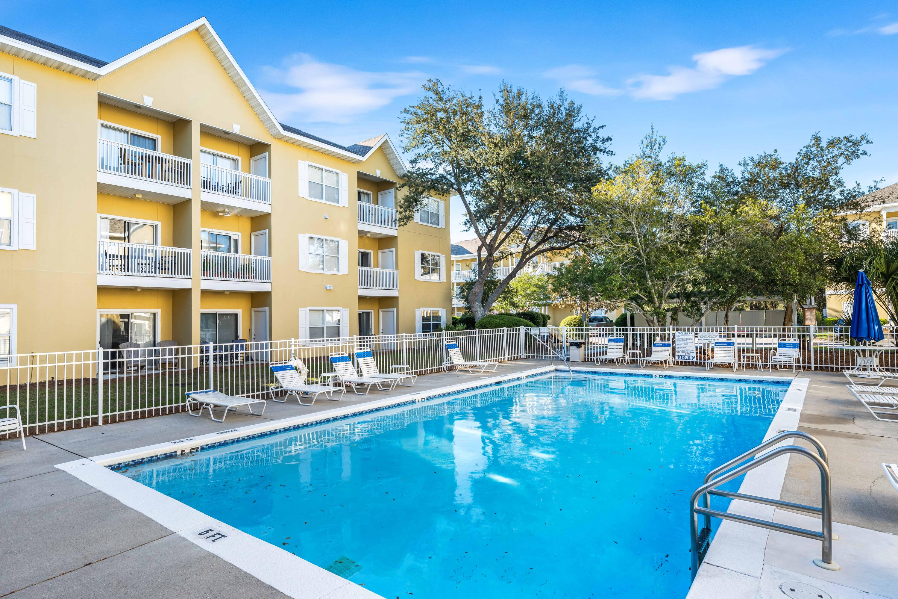 a view of a swimming pool with a lounge chairs