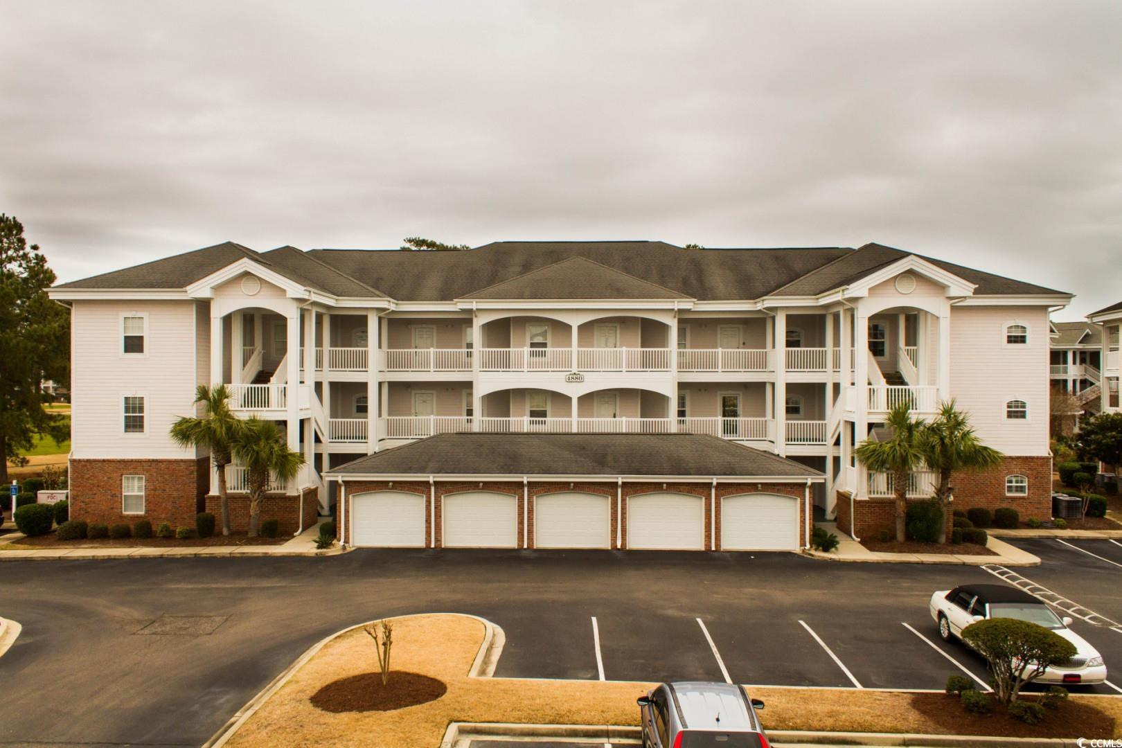 View of property featuring a garage