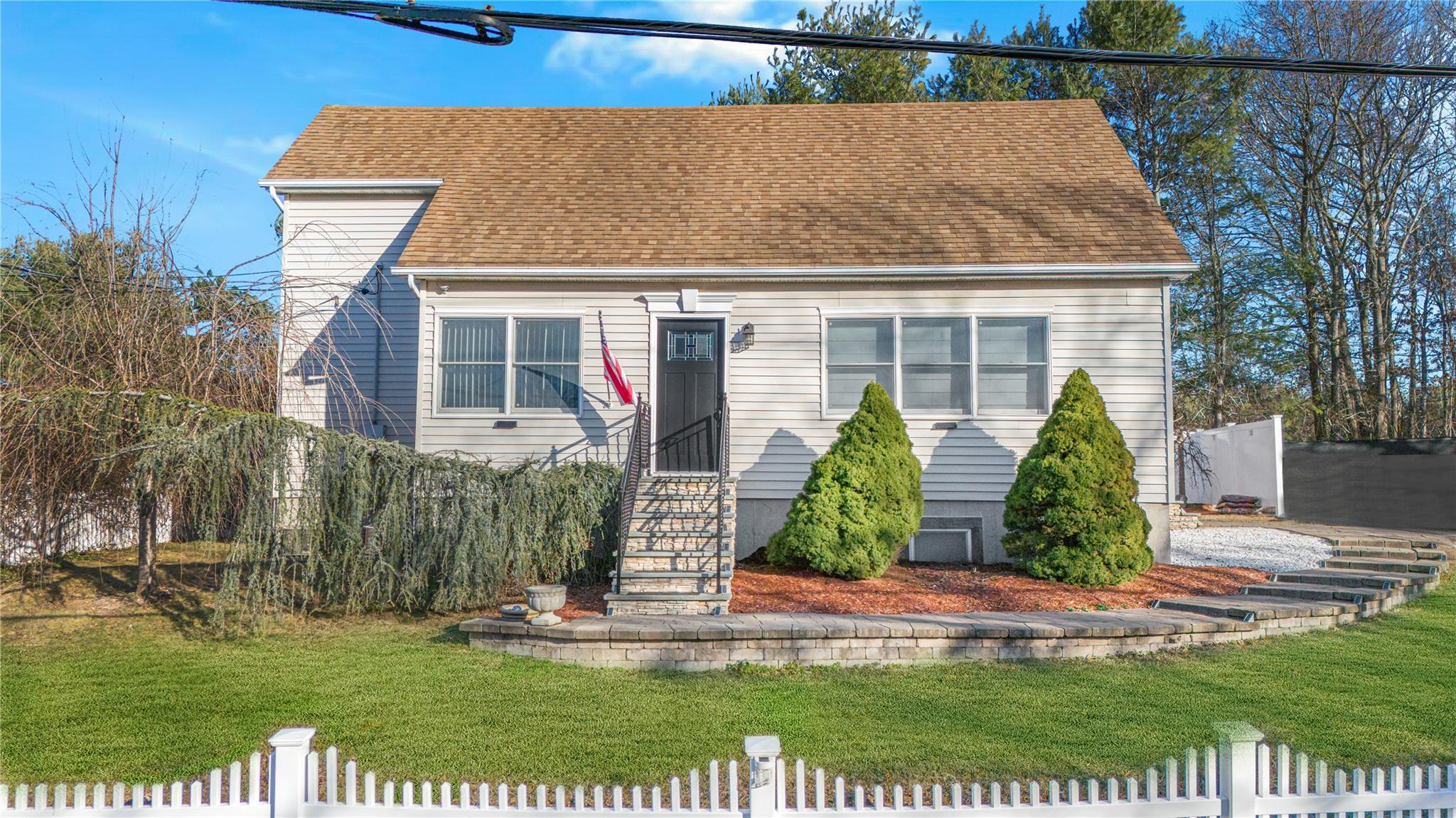 View of front of house with a front lawn