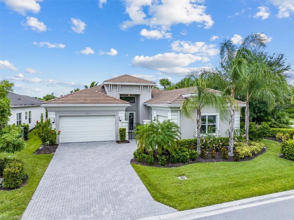 View of front of house featuring a front yard and a garage