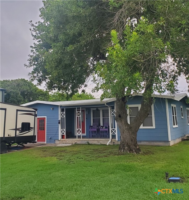 a front view of house with yard and green space