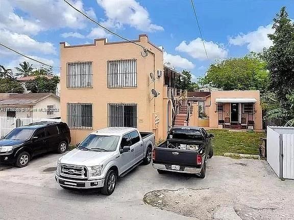 a car parked in front of a house