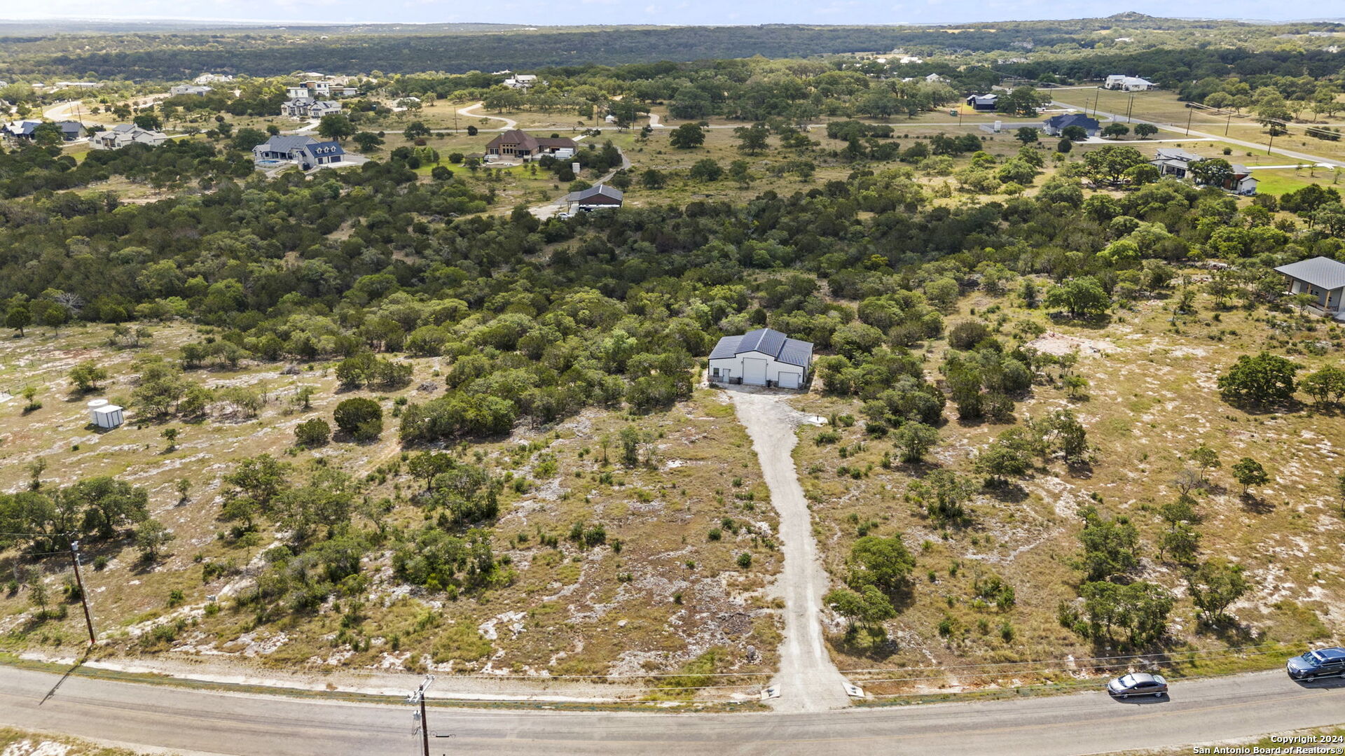 an aerial view of a houses with a outdoor space