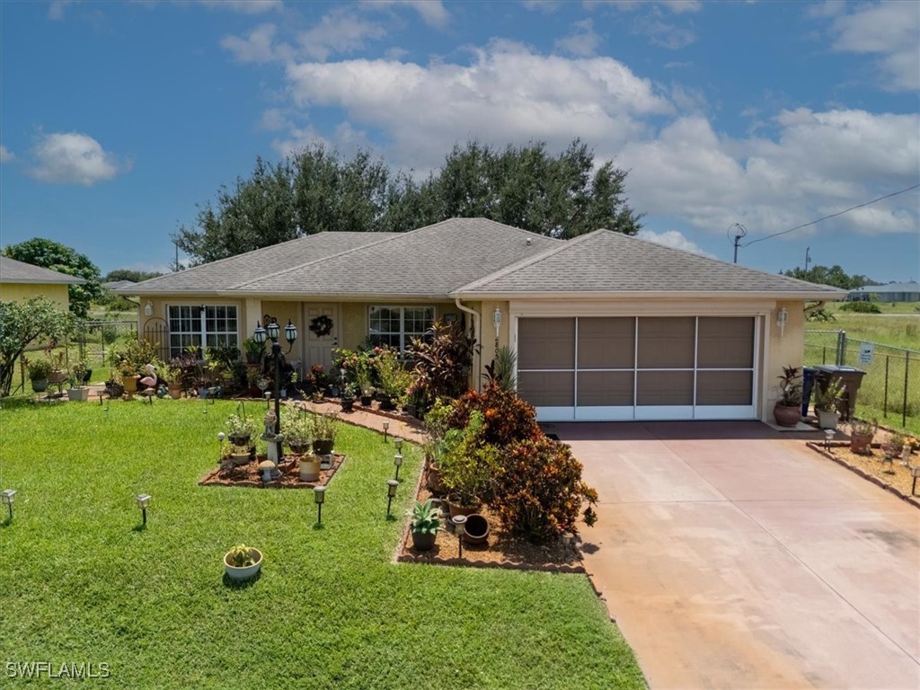 a front view of a house with garden