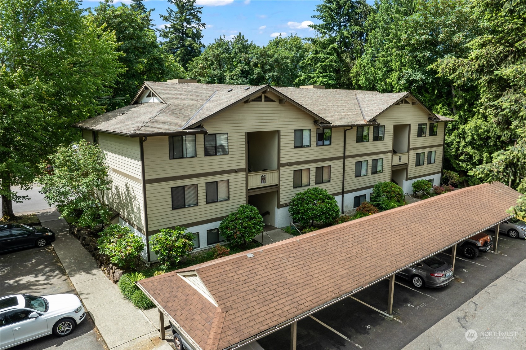 an aerial view of a house with yard porch and furniture