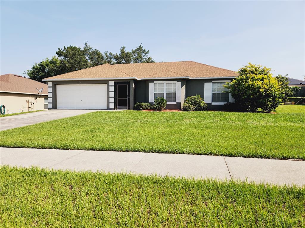 a view of a yard in front of a house