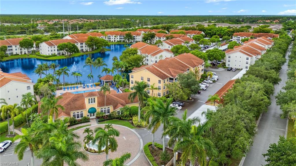 an aerial view of residential houses with outdoor space and river