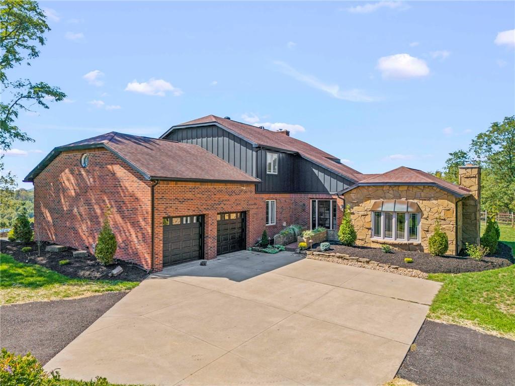 a front view of a house with a garden