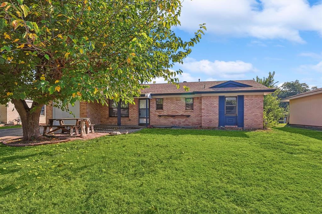 a view of a house with a yard porch and sitting area