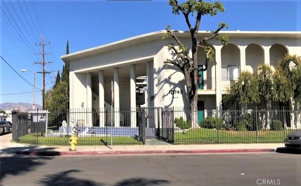 a view of a building with a street